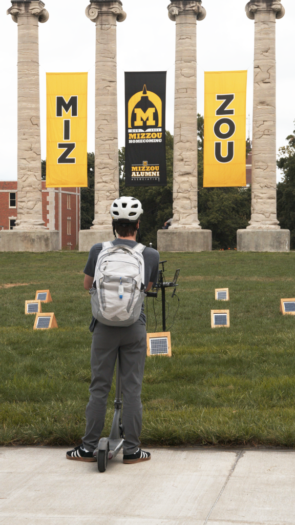A student experiences Craig Colorusso's "Sun Boxes" display